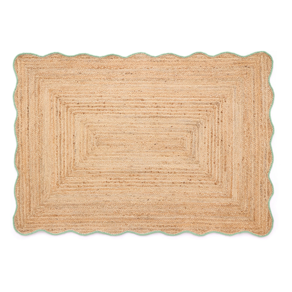 Beige braided rug on a white background