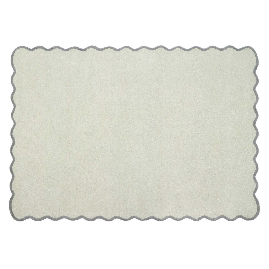 A rectangular area rug with a scalloped wavy border, shown flat against a plain white background.