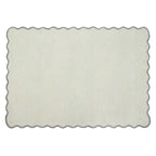 A rectangular area rug with a scalloped wavy border, shown flat against a plain white background.