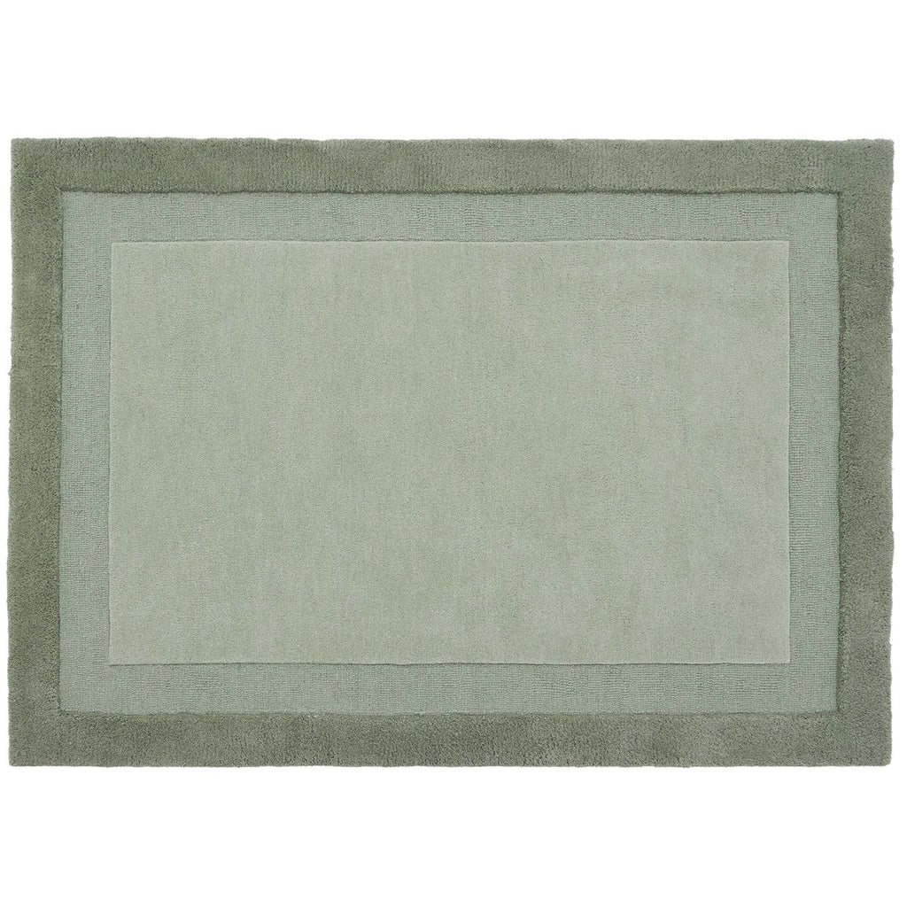 Green rug with a border on a white background