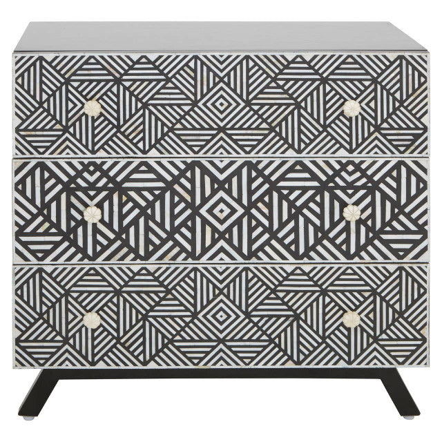 Three-drawer dresser with geometric black and white pattern on a white background