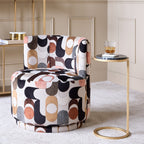 Patterned armchair in a stylish room with a side table and decor items.