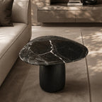 Black marble coffee table in a modern living room setting